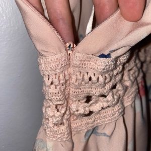 Light, pink, women’s dress. Size small, with lace cut out and fake buttons.